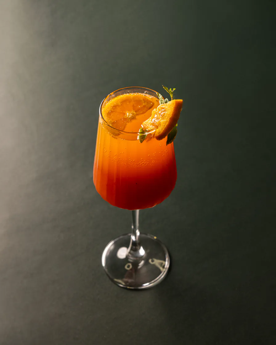 Citrus cocktail in a moody setting