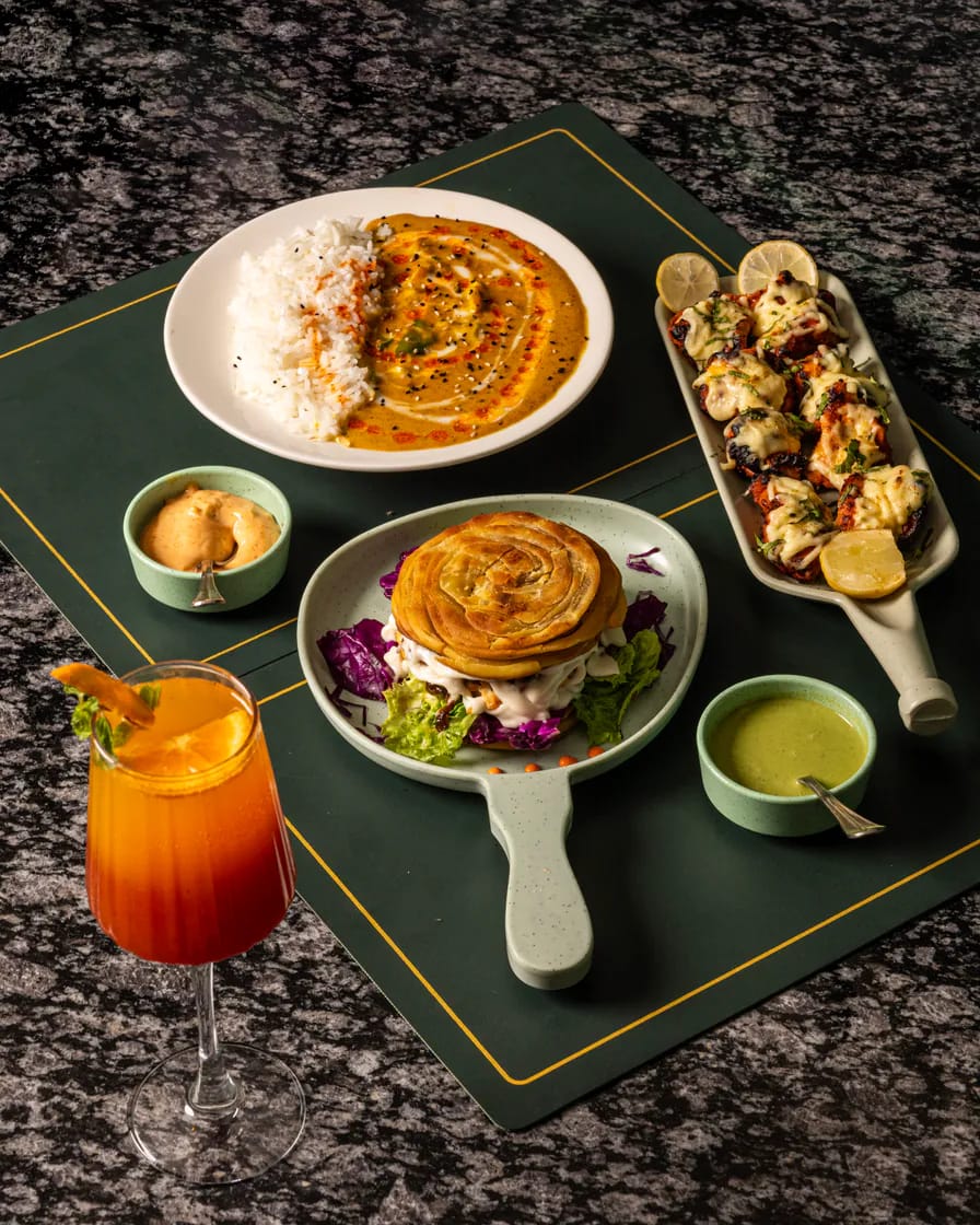Cocktail and dishes arranged on a table