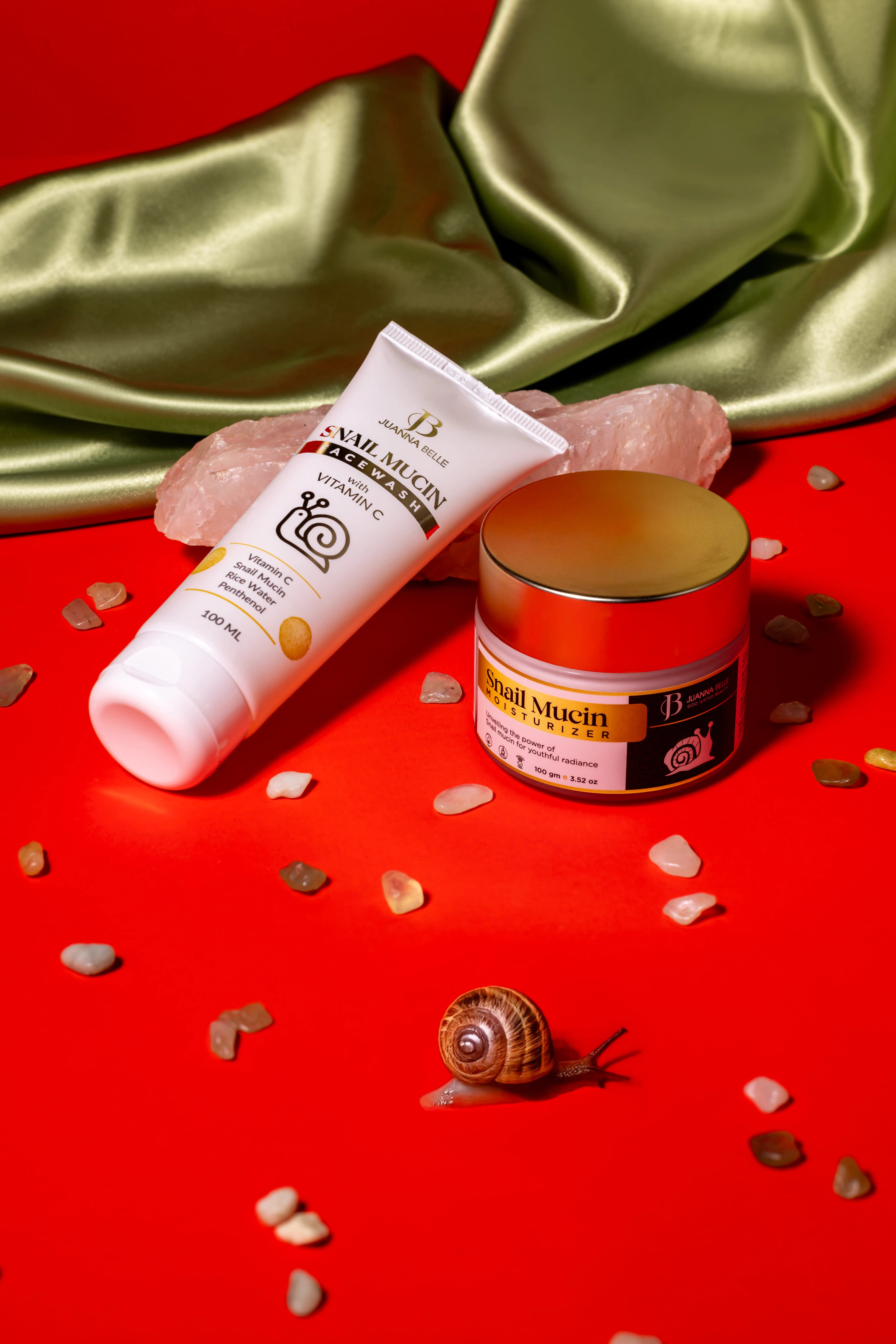 Snail skincare products among red petals