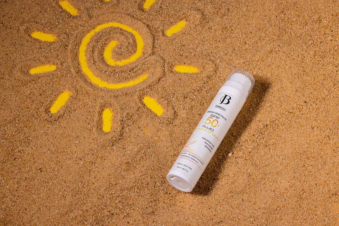 Sunscreen product styled in sand