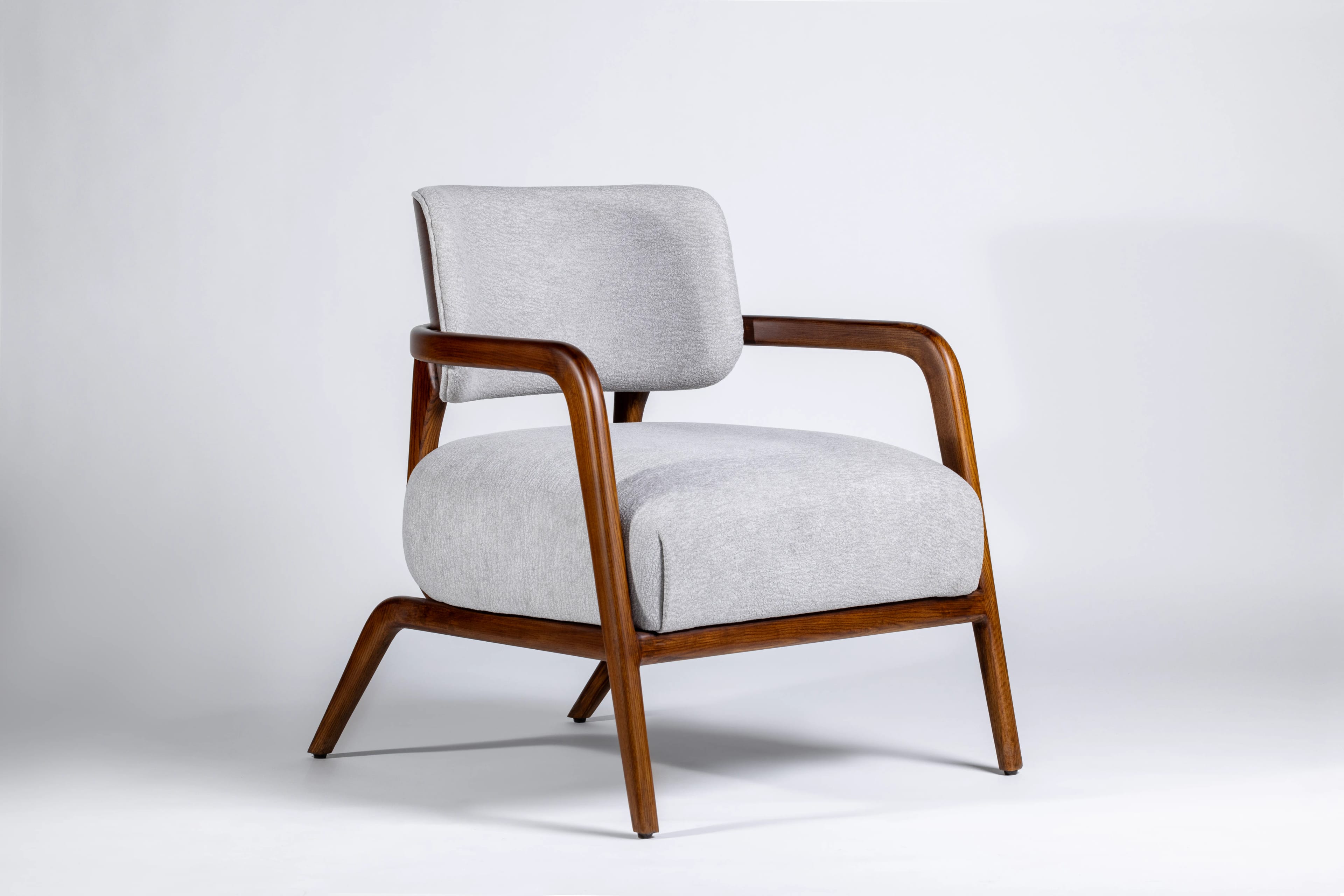 Walnut framed chair in a studio